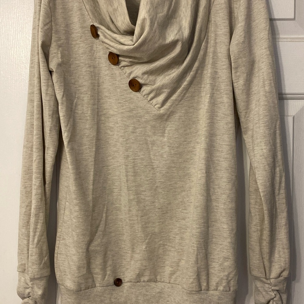 Nice Pullover, soft and stretchy, light gray, sleeves gather at wrist.